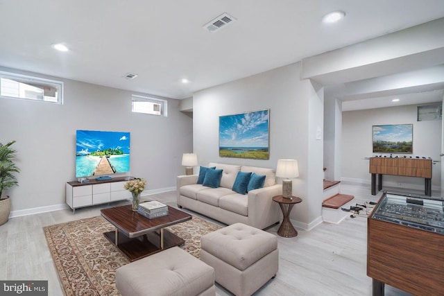 living room with light hardwood / wood-style floors