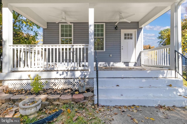 entrance to property featuring ceiling fan