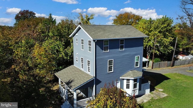 back of house with a yard