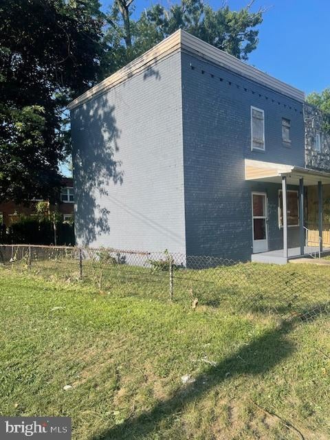 view of property exterior with a yard