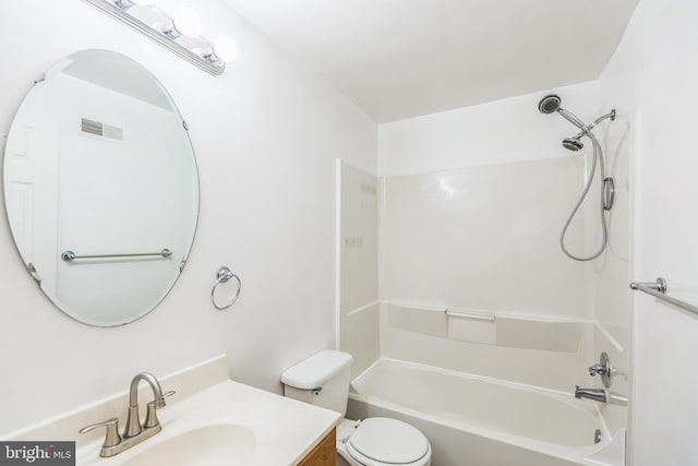 full bathroom featuring toilet, vanity, and  shower combination