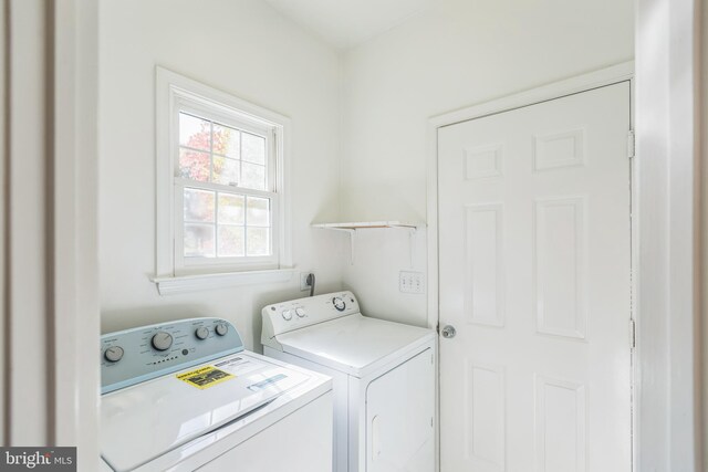 laundry room featuring washing machine and dryer