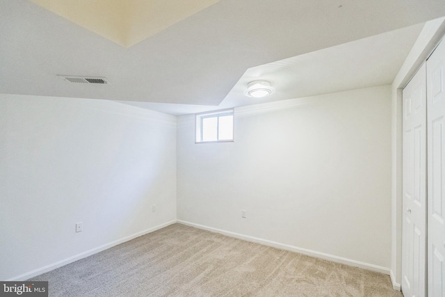 basement with light colored carpet