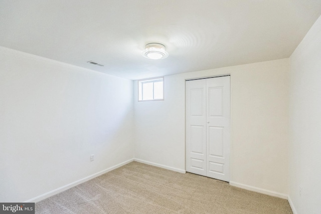 interior space featuring light carpet