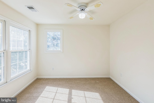 carpeted empty room with ceiling fan