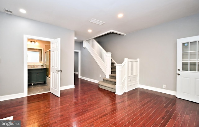 entrance foyer featuring wood finished floors, stairway, baseboards, and recessed lighting
