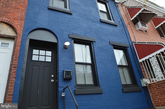 entrance to property with brick siding