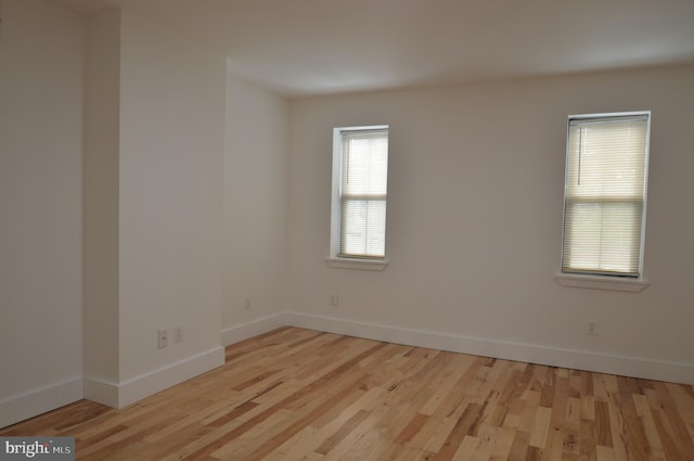 unfurnished room featuring light hardwood / wood-style floors