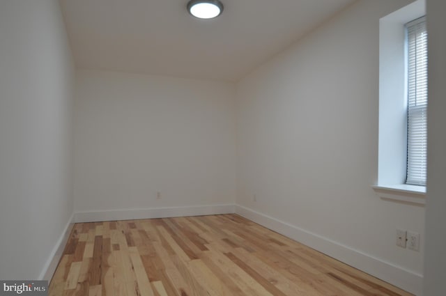 bonus room featuring vaulted ceiling and light wood-type flooring