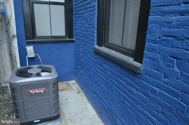 details featuring central air condition unit and concrete floors