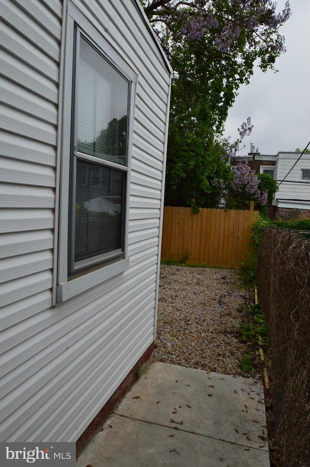 view of side of property featuring a patio