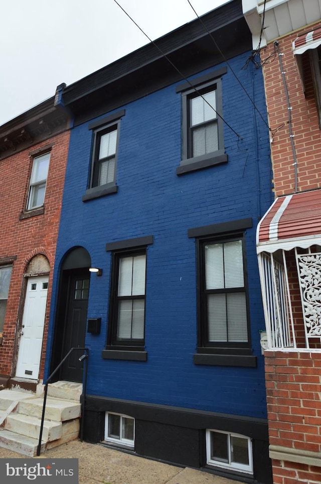 view of front of home with brick siding