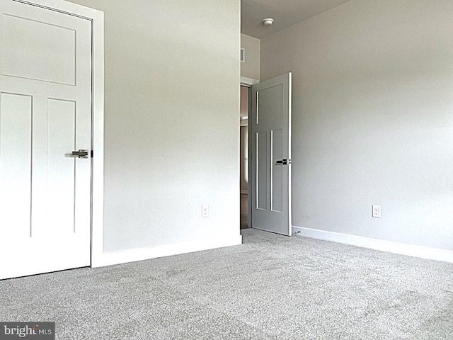 unfurnished bedroom with carpet floors