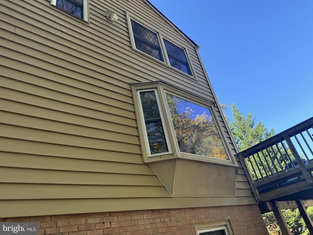 view of side of property featuring a deck