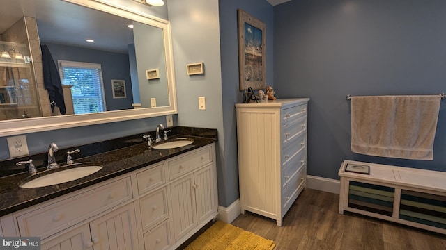 bathroom with hardwood / wood-style floors and vanity