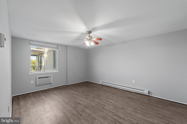 spare room with dark wood-type flooring, a baseboard heating unit, a wall mounted air conditioner, and ceiling fan