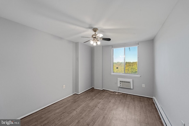 unfurnished room with ceiling fan, wood-type flooring, a baseboard radiator, and a wall unit AC