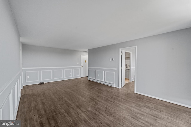 unfurnished room with dark hardwood / wood-style floors