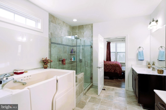 bathroom with vanity, an enclosed shower, and a healthy amount of sunlight