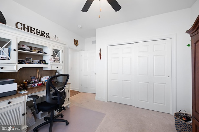 office featuring light carpet and ceiling fan