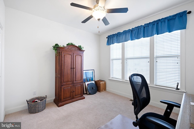 office area with ceiling fan and light carpet