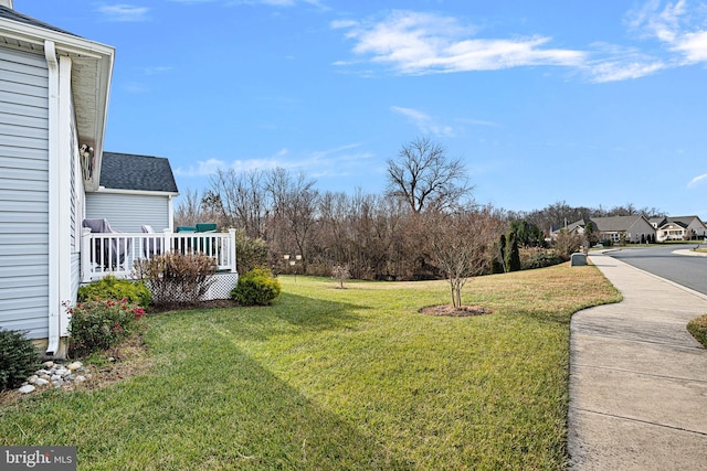 view of yard with covered porch