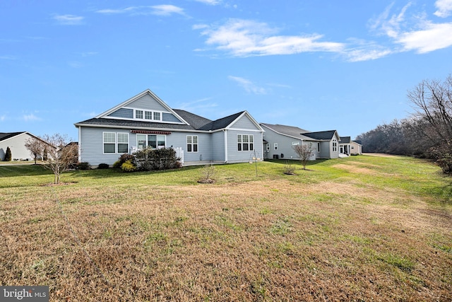 back of house with a yard