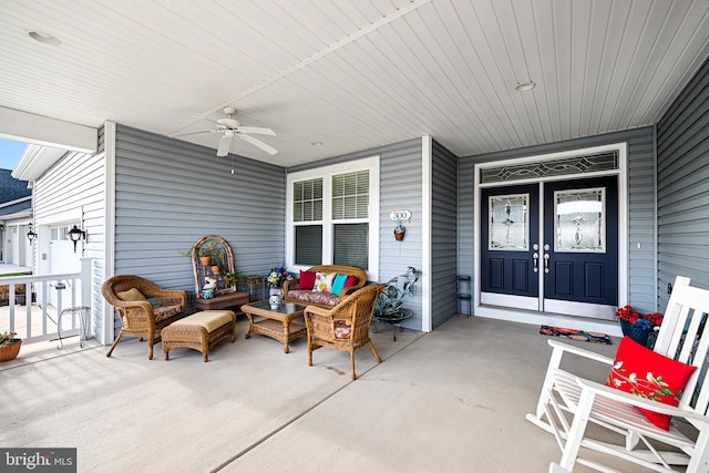 view of patio featuring an outdoor living space and ceiling fan