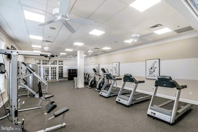 workout area featuring a drop ceiling and ceiling fan