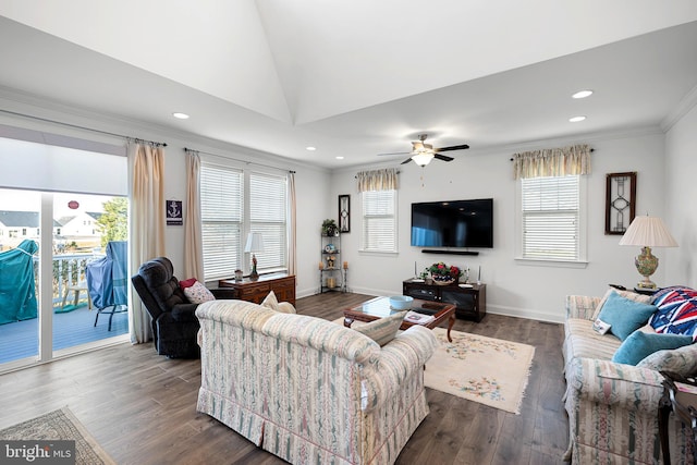 living room with lofted ceiling, ceiling fan, crown molding, and dark hardwood / wood-style floors