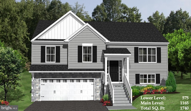 view of front of home featuring a front yard and a garage