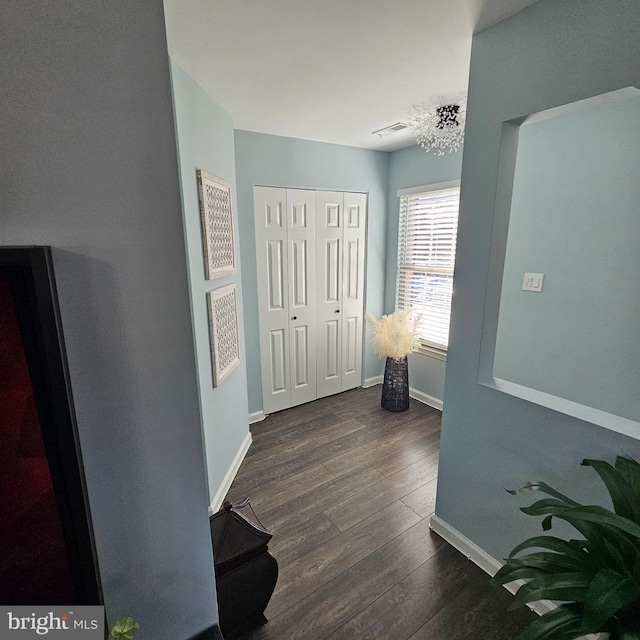 corridor featuring dark hardwood / wood-style floors