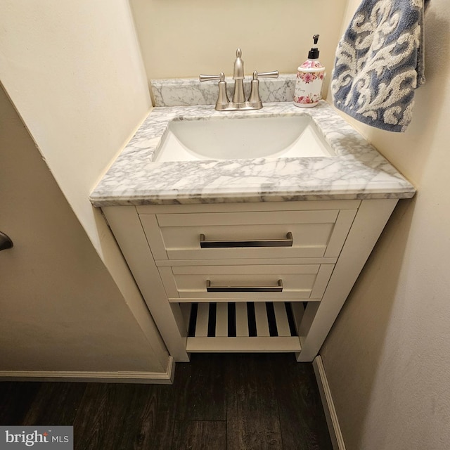 bathroom featuring vanity and wood-type flooring