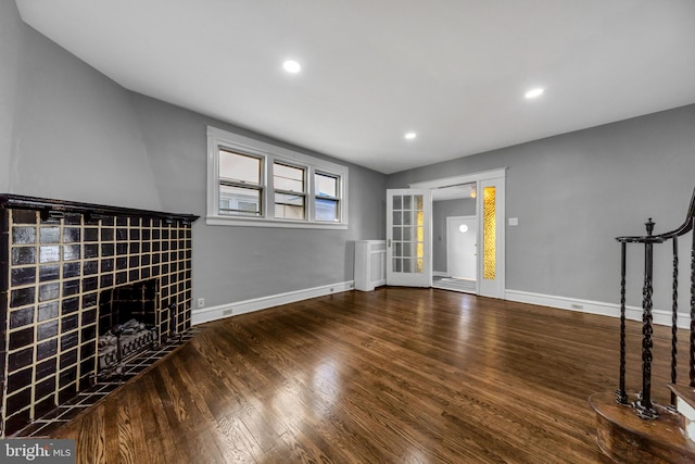 unfurnished living room featuring wood-type flooring