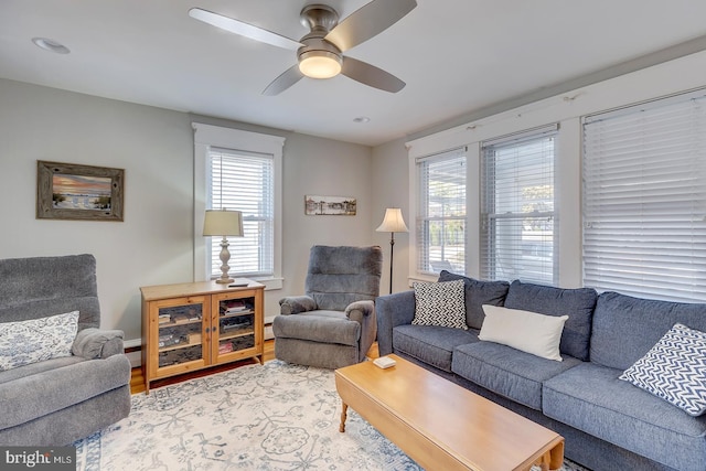 living room with hardwood / wood-style floors, plenty of natural light, and ceiling fan