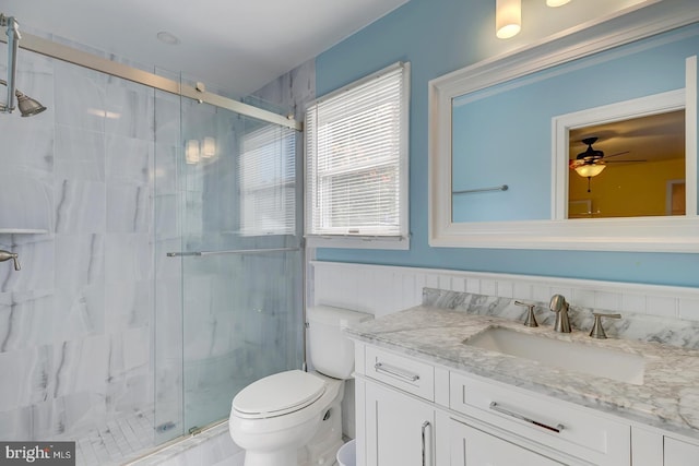 bathroom with vanity, toilet, and walk in shower