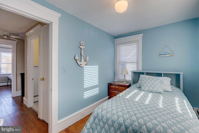 bedroom with hardwood / wood-style floors