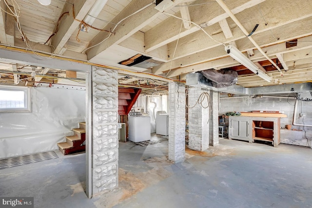 basement with washing machine and clothes dryer