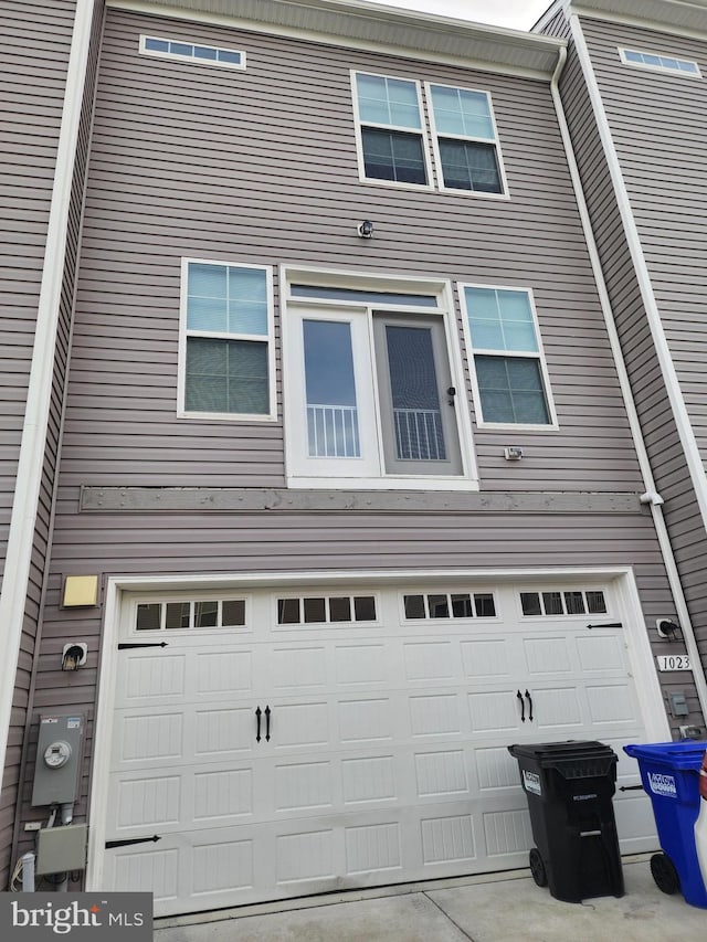 view of side of property with a garage