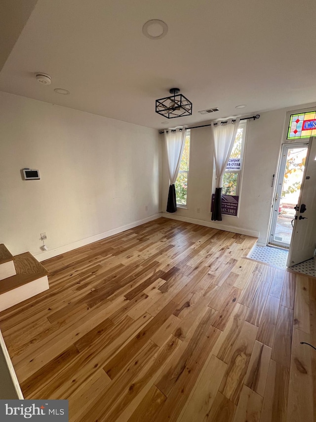 unfurnished dining area featuring light hardwood / wood-style flooring