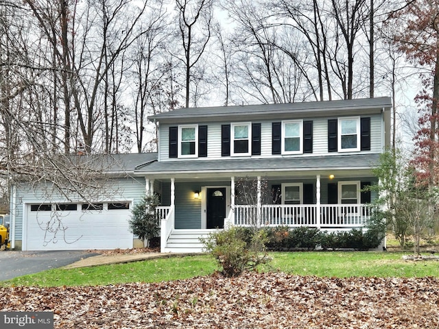 view of front of property with a porch and a garage