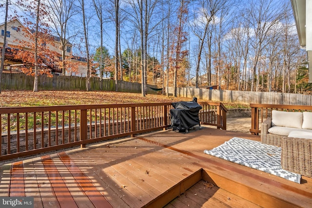 wooden deck featuring grilling area