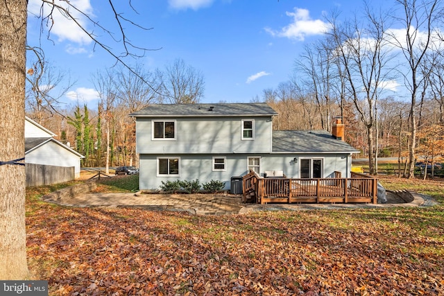 back of house featuring a wooden deck