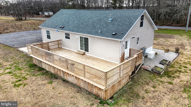 rear view of property with a wooden deck