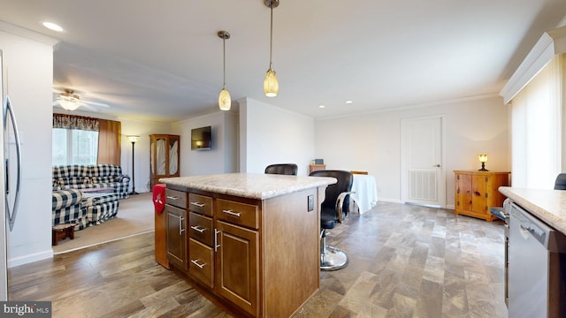 kitchen featuring dishwasher, a center island, hanging light fixtures, ceiling fan, and ornamental molding