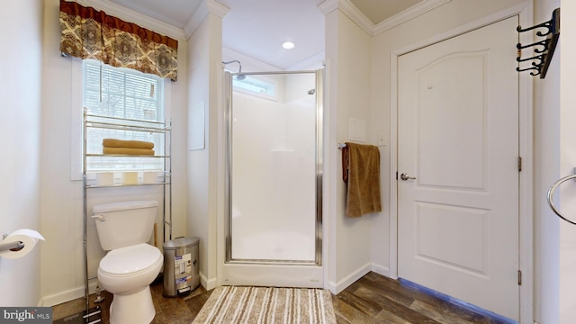 bathroom with hardwood / wood-style floors, toilet, walk in shower, and crown molding