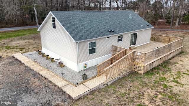 rear view of house with a wooden deck