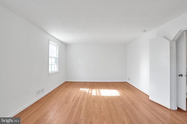 spare room with light wood-type flooring