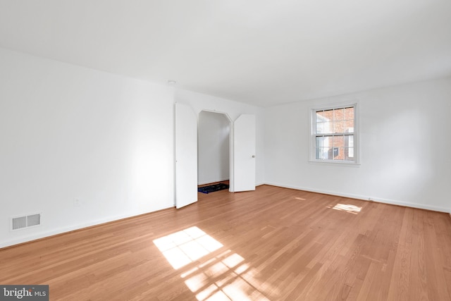 spare room with light hardwood / wood-style floors