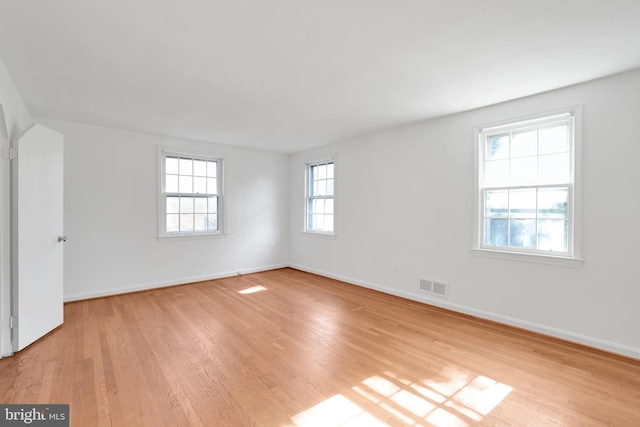 spare room with light wood-type flooring